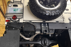 1992-White-Land-Rover-Defender-90-on-lift-1